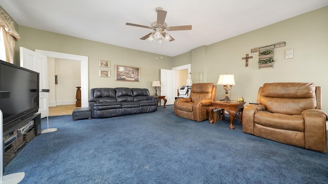 living room featuring ceiling fan and carpet