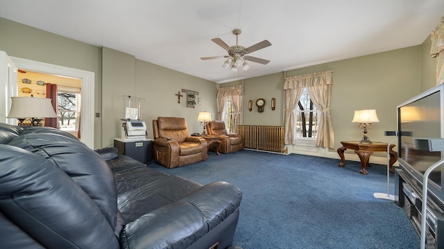 living room featuring carpet, radiator heating unit, and ceiling fan