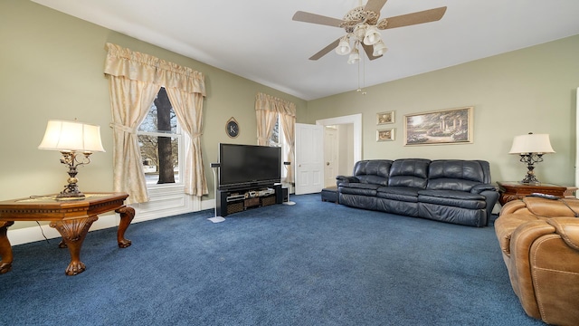 living room featuring ceiling fan and carpet