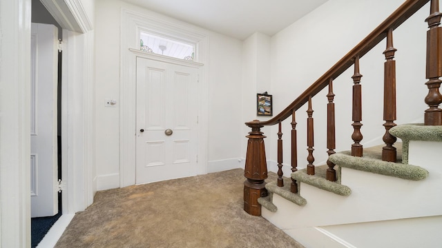 view of carpeted entrance foyer