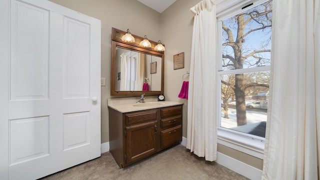 bathroom with a healthy amount of sunlight and vanity