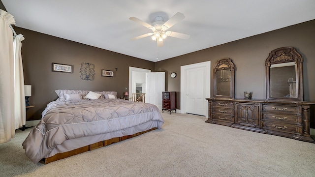 bedroom with light carpet and ceiling fan