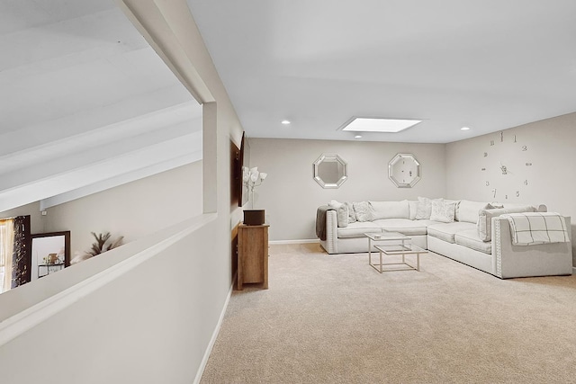 living room featuring light carpet and a skylight