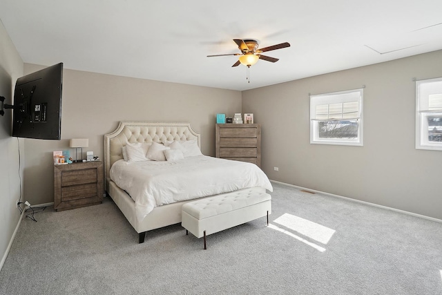 bedroom with light colored carpet and ceiling fan