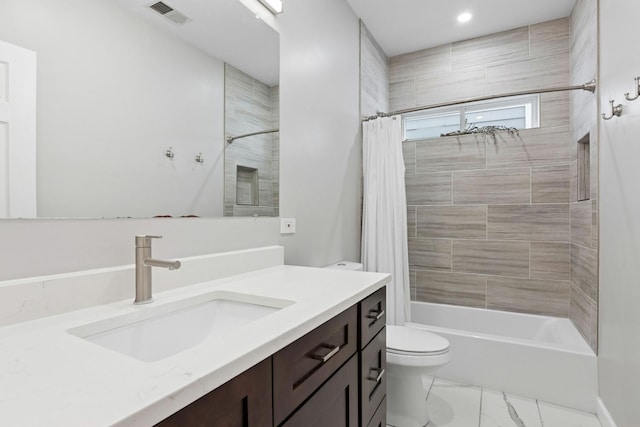 full bathroom featuring visible vents, toilet, shower / tub combo, marble finish floor, and vanity