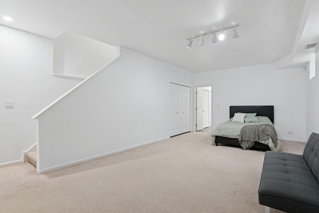 bedroom featuring carpet, visible vents, and baseboards