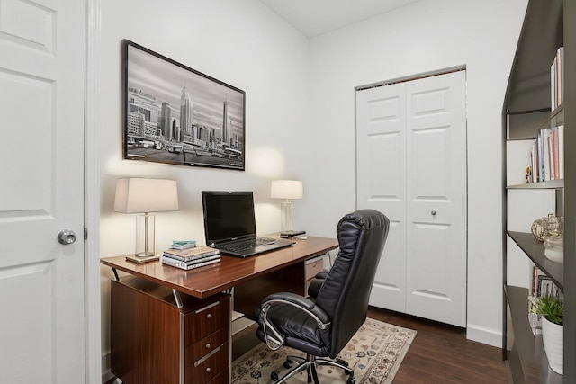 office space with dark wood-style flooring