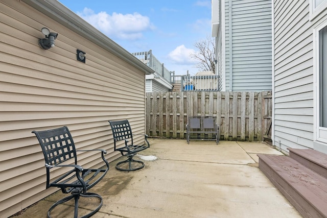 view of patio / terrace featuring fence