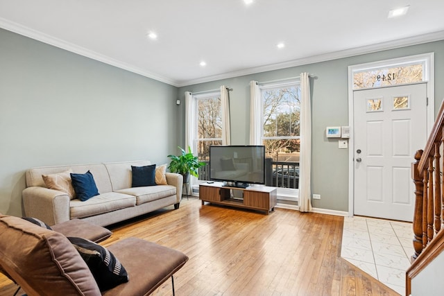 living area featuring baseboards, recessed lighting, ornamental molding, stairs, and hardwood / wood-style flooring