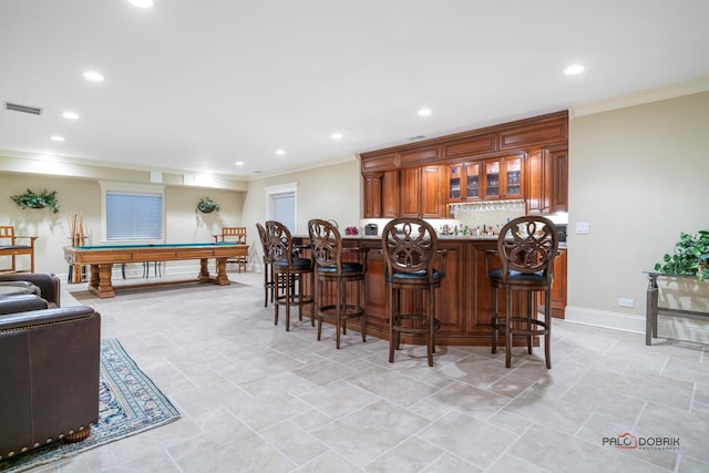 bar with tasteful backsplash, crown molding, and billiards