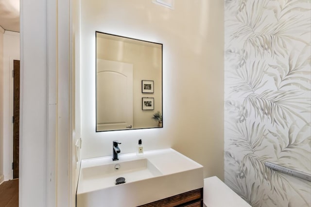 bathroom with toilet and vanity