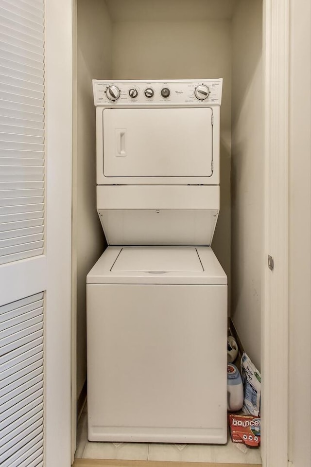 laundry room with laundry area and stacked washer / drying machine