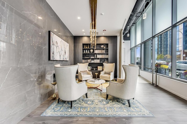 interior space with recessed lighting, tile walls, and wood finished floors