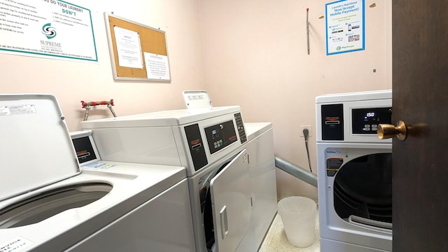 common laundry area with separate washer and dryer