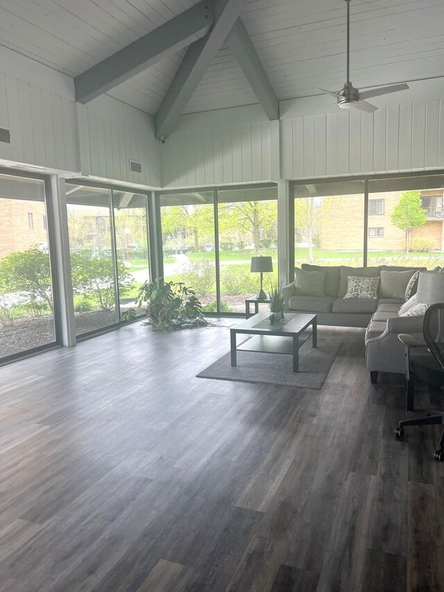 sunroom / solarium with an outdoor hangout area, a ceiling fan, beam ceiling, and a wealth of natural light