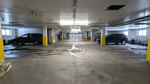 parking garage featuring a garage door opener