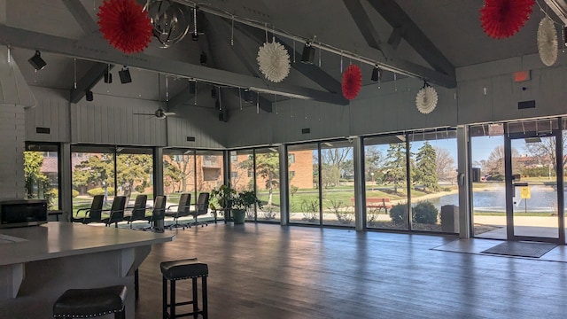sunroom featuring beamed ceiling