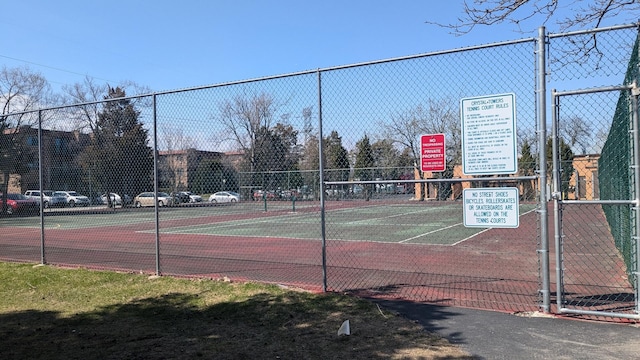 view of tennis court with fence