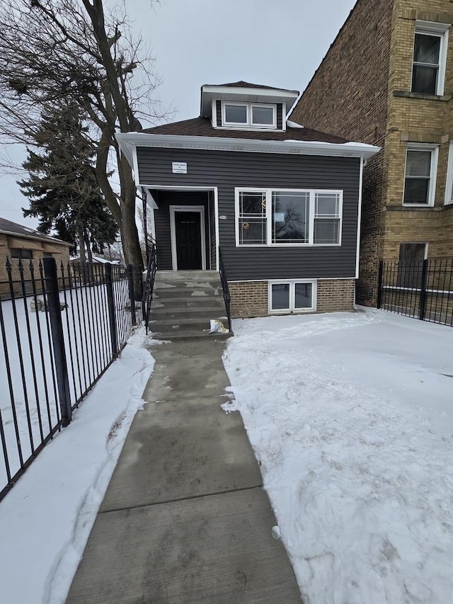 view of front of house with fence