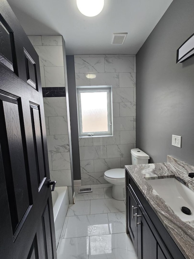 2040 W Garfield Blvd, Chicago, IL 60609 - bathroom with vanity, toilet, visible vents, and marble finish floor