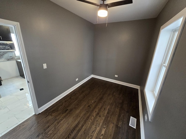 2040 W Garfield Blvd, Chicago, IL 60609 - empty room featuring visible vents, ceiling fan, baseboards, and wood finished floors