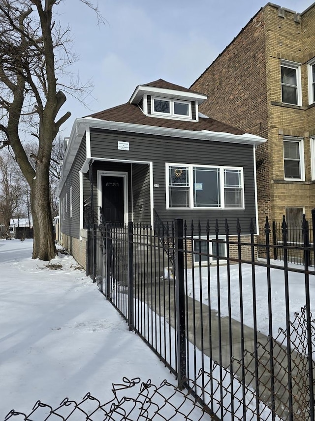 2040 W Garfield Blvd, Chicago, IL 60609 - view of front of home featuring a fenced front yard and roof with shingles
