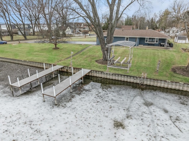 exterior space with a water view and a yard