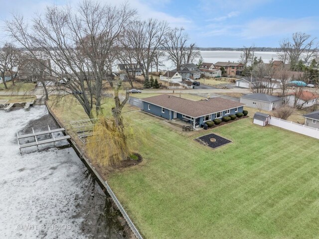 view of yard with a water view and a residential view