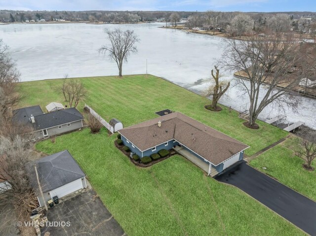 bird's eye view featuring a water view and a residential view