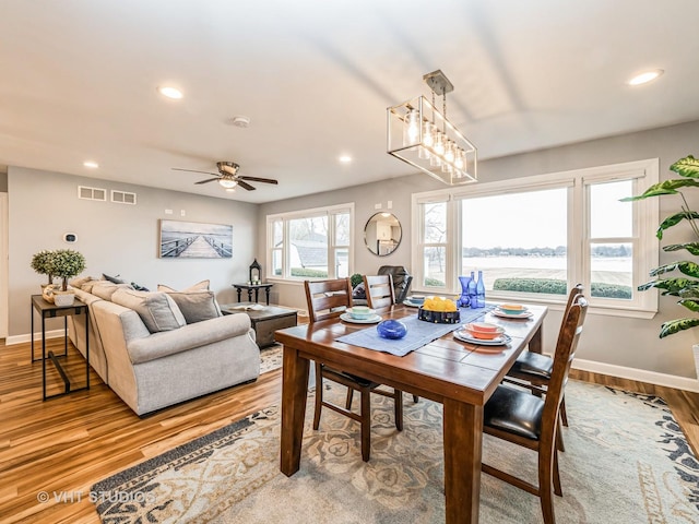 dining space with recessed lighting, baseboards, visible vents, and light wood finished floors