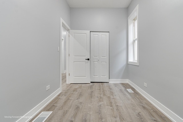 unfurnished bedroom featuring light hardwood / wood-style flooring