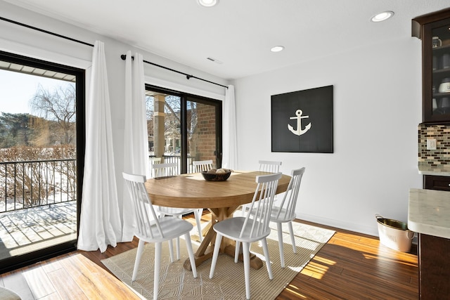 dining space featuring hardwood / wood-style flooring