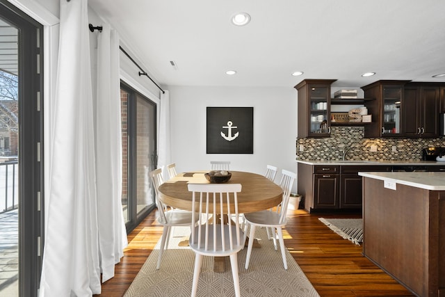 dining room with dark hardwood / wood-style floors and plenty of natural light