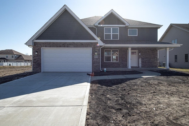 view of front of property featuring a garage and covered porch