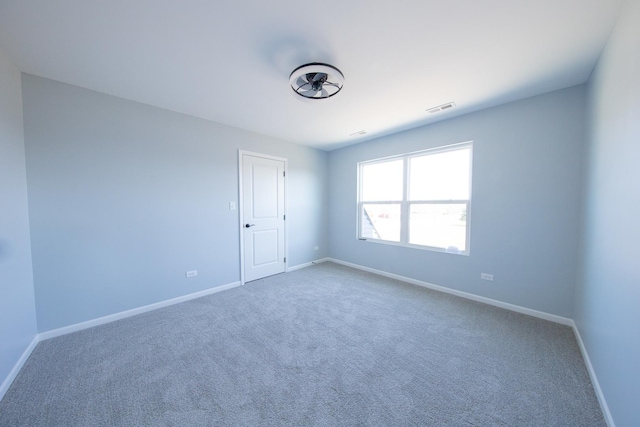 spare room with carpet