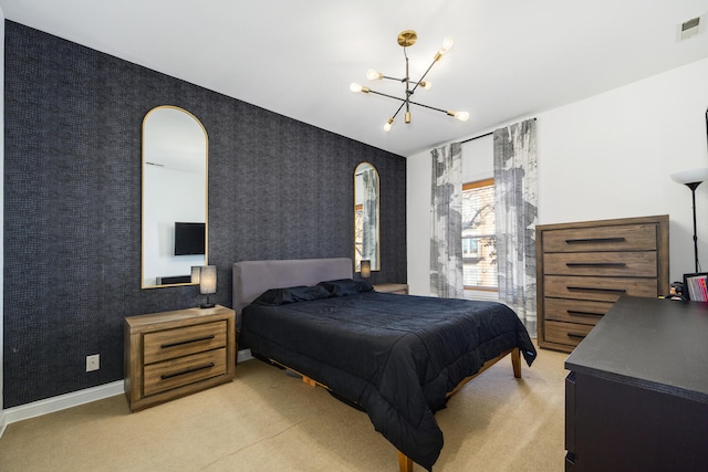 carpeted bedroom with a notable chandelier