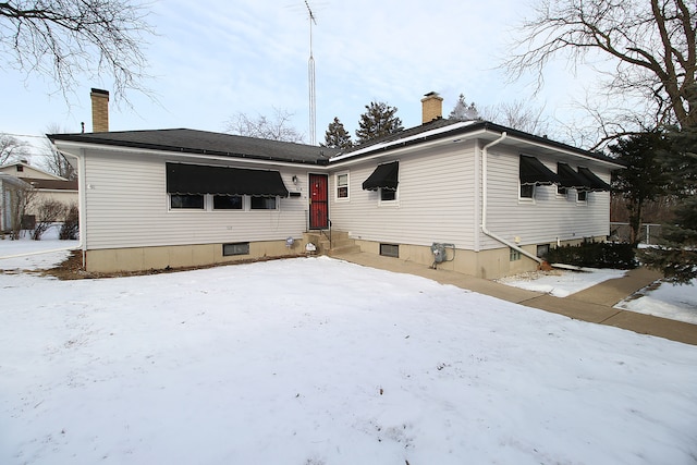 view of snow covered house