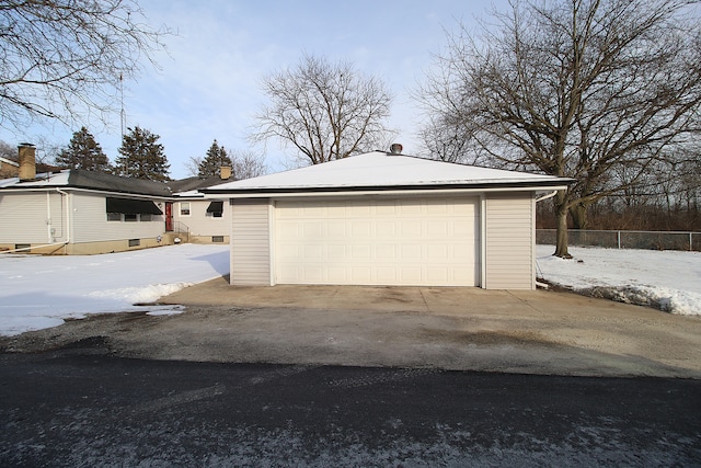 view of snow covered garage