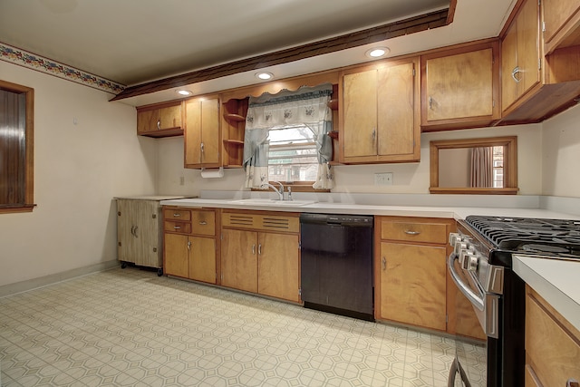 kitchen featuring gas range, black dishwasher, and sink