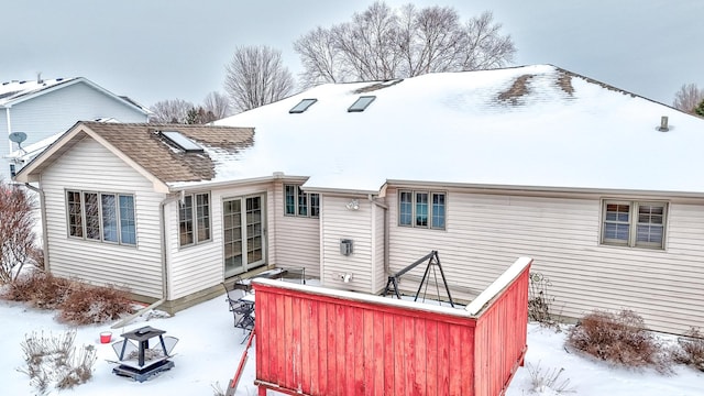 view of snow covered property