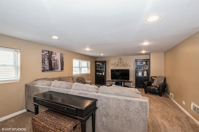 living room with carpet flooring, baseboards, visible vents, and recessed lighting