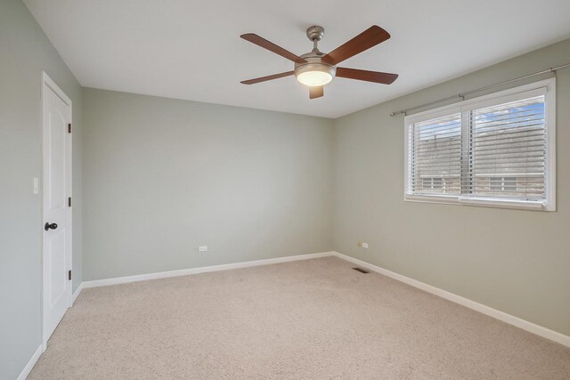 carpeted empty room with ceiling fan