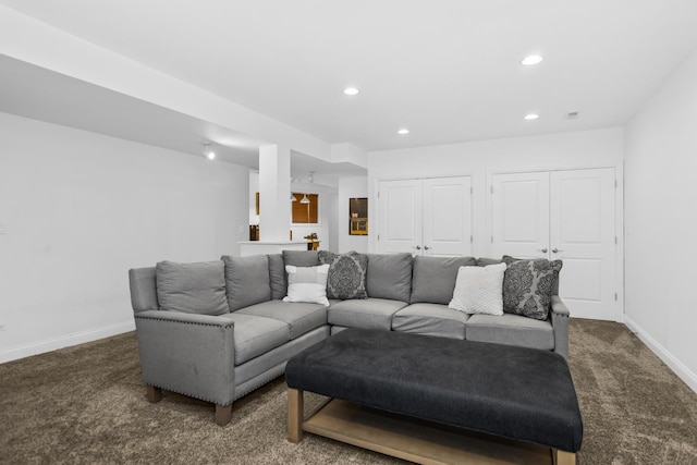 living area with recessed lighting, carpet, and baseboards