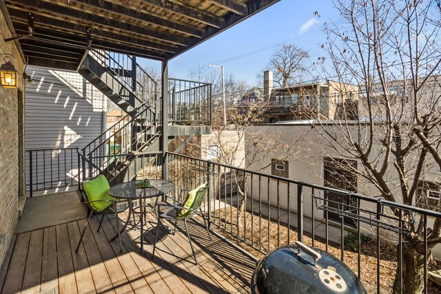 balcony featuring stairs