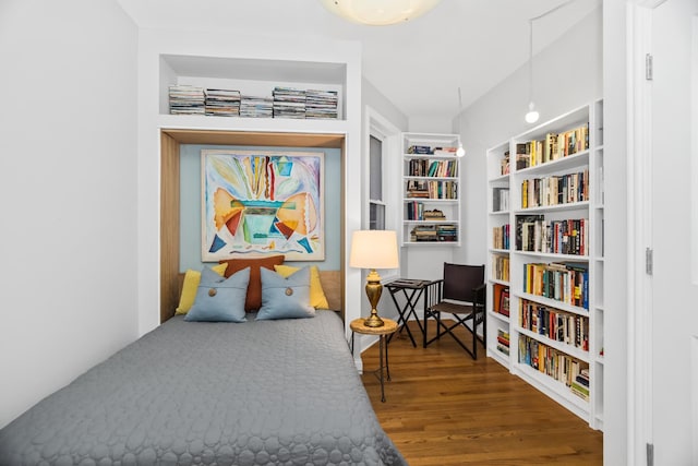 bedroom featuring wood finished floors