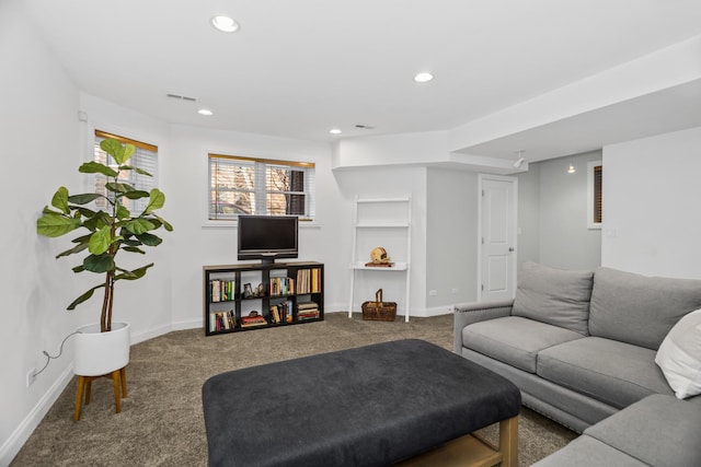 carpeted living area with visible vents, baseboards, and recessed lighting