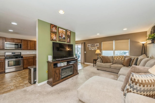 carpeted living room with a wealth of natural light