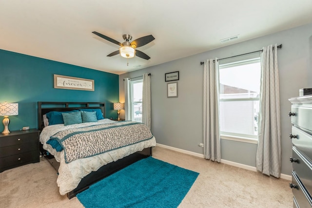 carpeted bedroom with ceiling fan