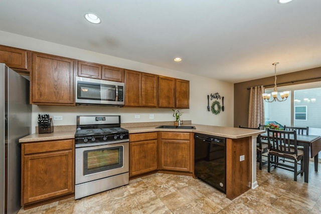 kitchen with sink, an inviting chandelier, hanging light fixtures, stainless steel appliances, and kitchen peninsula