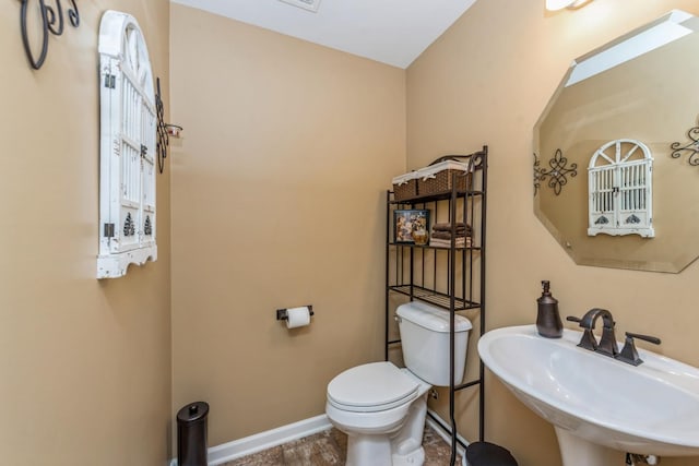 bathroom featuring sink and toilet